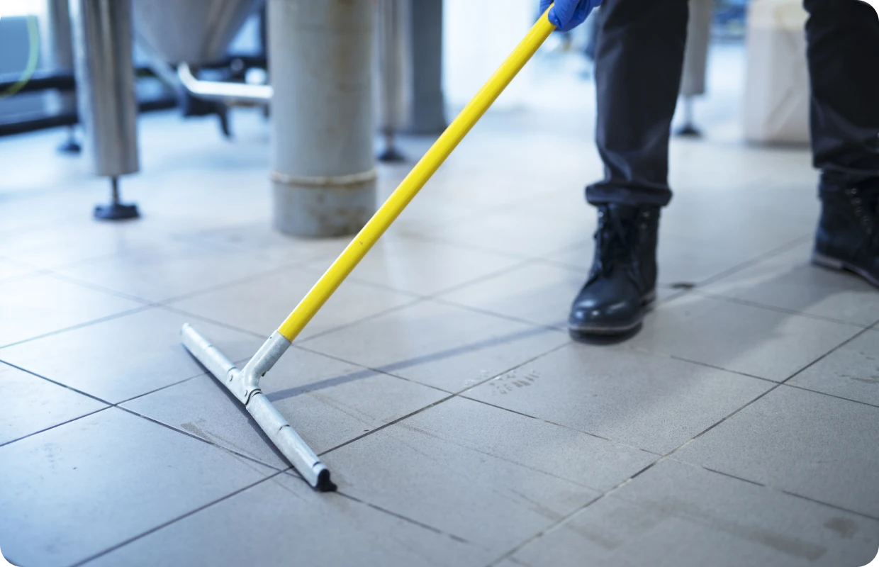 Person mopping tile floor