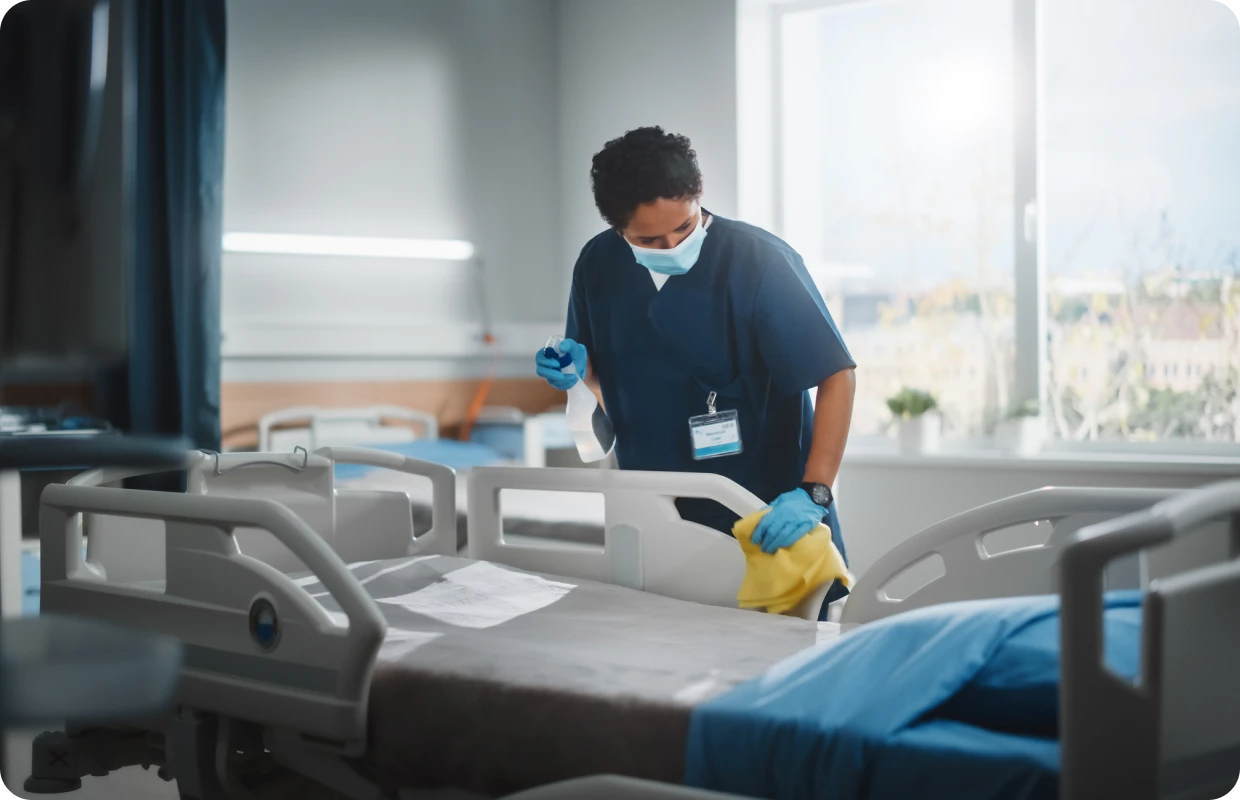 Medical professional sanitizing a hospital environment